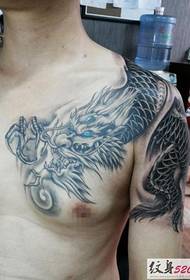 male classic domineering over-the-shoulder tattoo