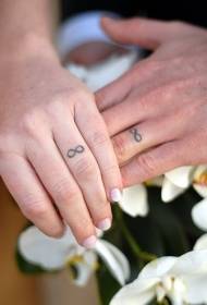 couple black infinity symbol wedding ring tattoo