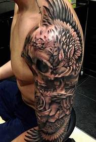 arm skull wings tattoo pattern