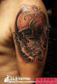 male arm a classic cool skull tattoo pattern
