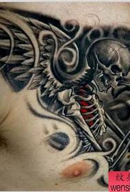 a domineering wing tattoo on the chest