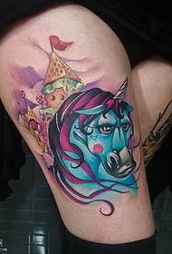 cartoon unicorn tattoo on the thigh