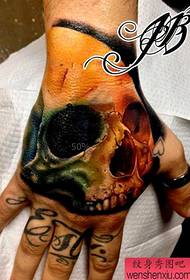 a popular color skull tattoo on the back of the hand