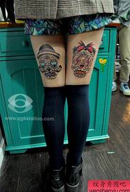 girls legs Beautiful couple skull tattoo pattern