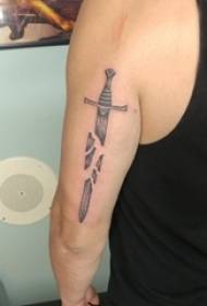 boys arm on black gray point thorn simple line dagger tattoo picture