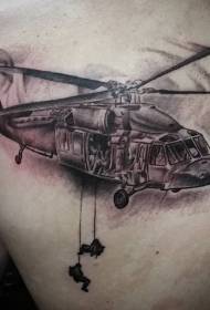 Bumalik ang itim na kulay abo na helikopter ng militar na may pattern ng tattoo ng sundalo