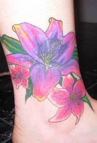 sieviešu pliko kailu krāsu liliju ziedu tetovējums