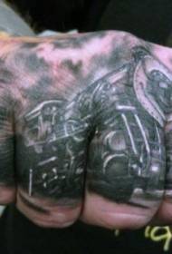 black locomotive tattoo pattern on the back of the hand
