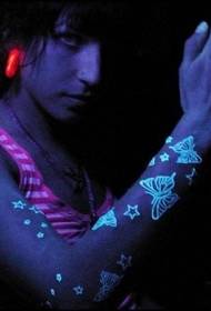 star and butterfly fluorescent arm tattoo pattern
