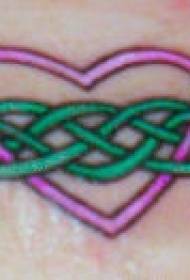 Female wrist green grate love tattoo pattern