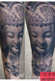 腿部经典的黑白石雕佛头纹身图案