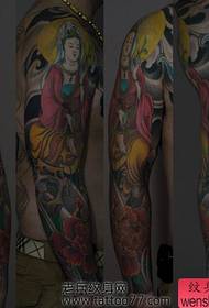 a Guanyin peony flower arm tattoo pattern
