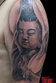 an arm smiley face Guanyin tattoo pattern