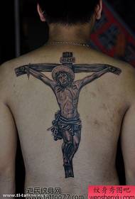 ett bakre kors av tatueringsmönstret Jesus