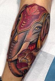 a festive elephant tattoo on the calf