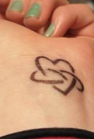 Female wrist on black line creative heart shaped cute tattoo picture