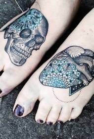 Colorful human skull and heart tattoo in foot engraving style