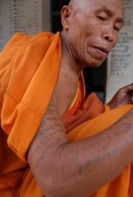 Buddhist monk arm scripture tattoo pattern