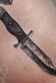 a dagger tattoo on the thigh