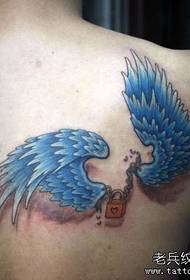 boys shoulders a colorful wing tattoo pattern