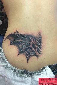 a popular demon wing tattoo pattern in the back waist