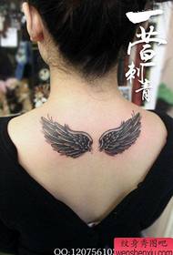 girls back a black and white wings tattoo pattern