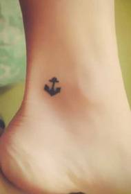 Small fresh anchor tattoo pattern on the legs