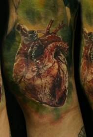 Colorful heart tattoo picture of arm realism style