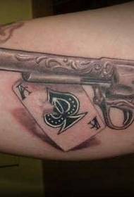 Arm card pistol tattoo pattern