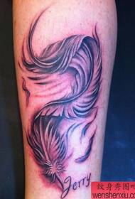 girl's legs flowing feather tattoo pattern