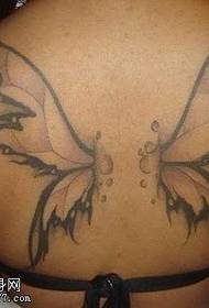 Back breaks into a butterfly wing tattoo pattern