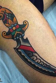 Leg painted dagger tattoo pattern