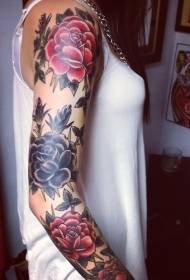 colored rose tattoo on the arm