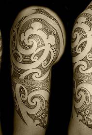 handsome tribal totem tattoo picture on the right arm of the man