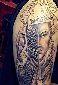The big arm tattoo pattern of the fusion of the devil and the Buddha