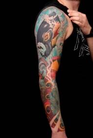 blue whale tattoo pattern on male arm