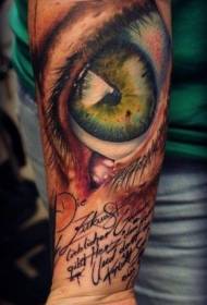 Arm very realistic green eyes and letter tattoo pattern