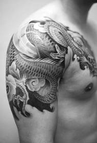 man's right arm on black-gray over-the-shoulder tattoo picture