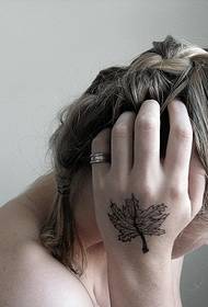 woman's hand on the back of the beautiful Maple Leaf Tattoo Pattern