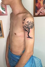 men's arm a small tree tattoo pattern