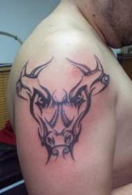 The handsome bull totem tattoo picture on the right hand arm of the man