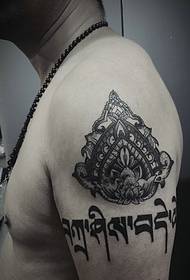 Sanskrit with personality pattern with arm tattoo