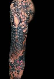traditional squid tattoo pattern covering the entire arm
