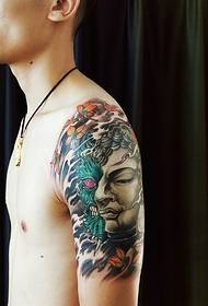Buddha and the magic combined with the flower arm tattoo pattern