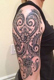 female arm totem tattoo