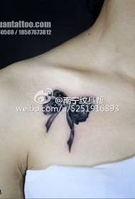 Small bow tattoo pattern on the shoulder