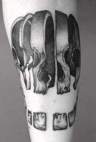 Wzór tatuażu ramię czarny szary plasterek ludzkiej czaszki