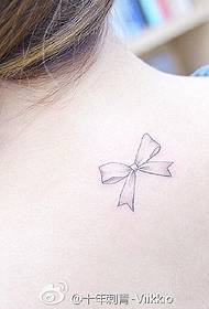 Fresh bow tattoo on the back