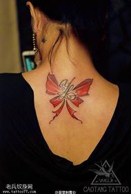 Bow tattoo on the back