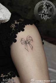 Thorn bow tattoo on the calf